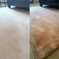 people working in the office with a main person cross-armed on the right looking at the camera